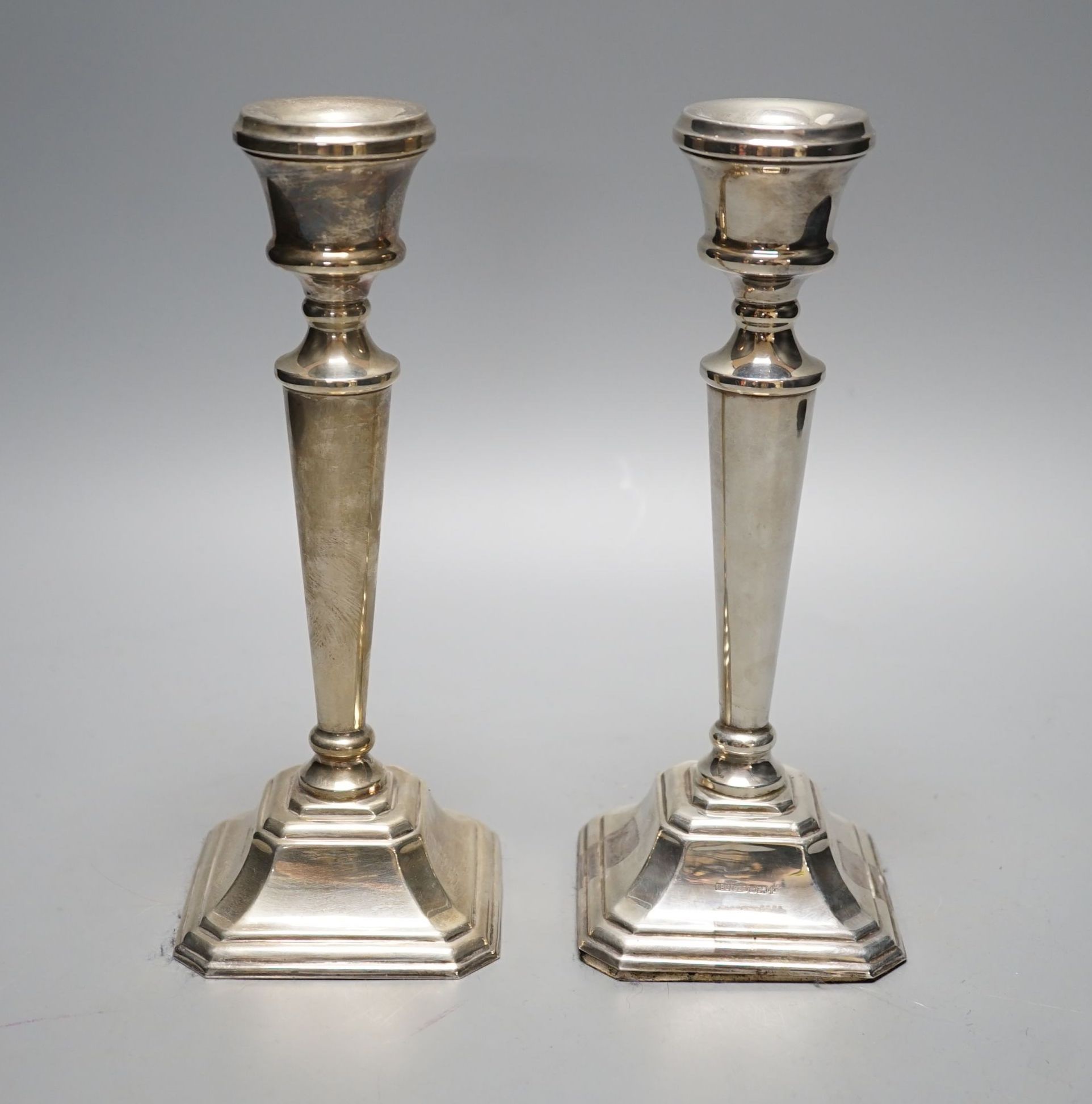 A modern pair of silver mounted candlesticks, JD Ltd, Birmingham, 2000, height 21.5cm, weighted.